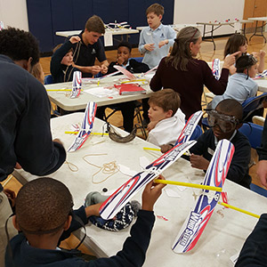 Annapolis students working on airplanes