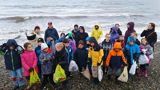 Surrey Christian School cleaning up garbage from tide pools