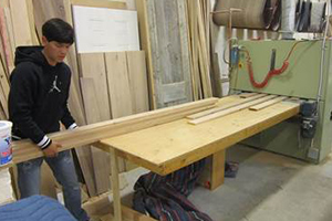 One of the students working at Meyers Cabinet shop.