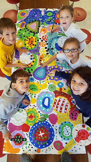 Young students working on a collective art project