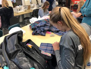 Timothy Christian reFashion class student sewing a new creation